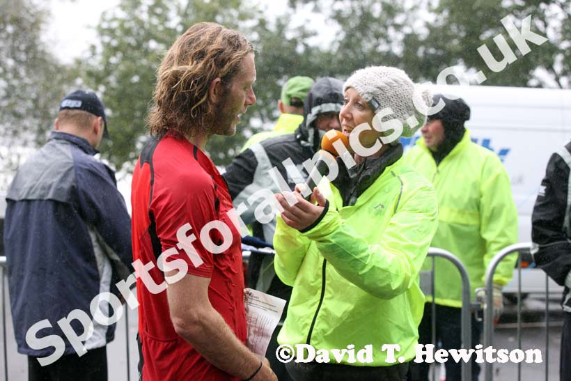 Allison Curbishley interviews Ceri Rees after his victory in the Kielder Marathon. Photo: David T. Hewitson/Sports for All Pics